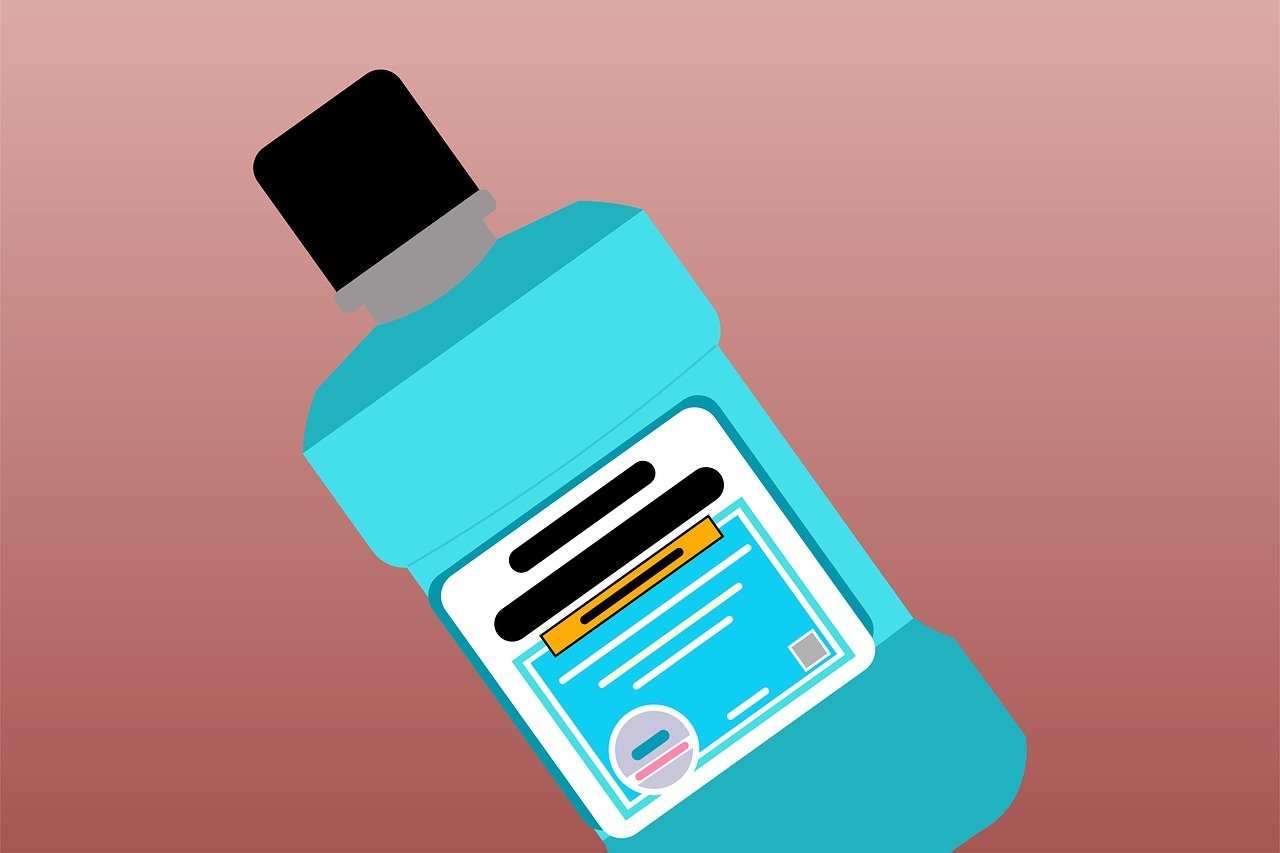 Illustration of a teal mouthwash bottle with a black cap, featuring an abstract label design. The background is a gradient of pink and brown shades.